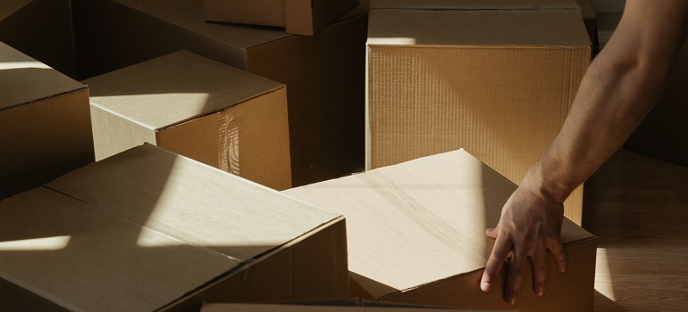 someone packing items and maximizing daylight for January Toronto move