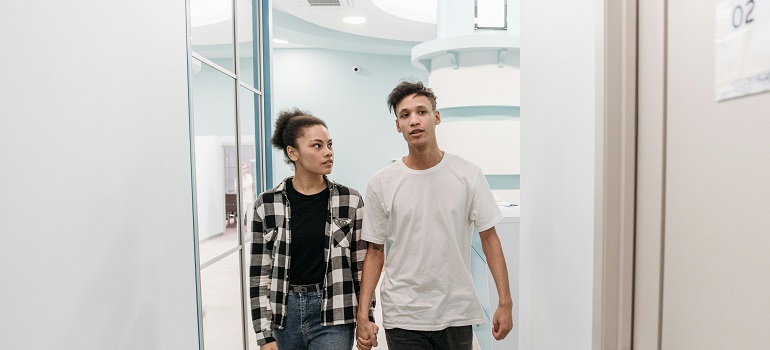 a couple walking into a clinic