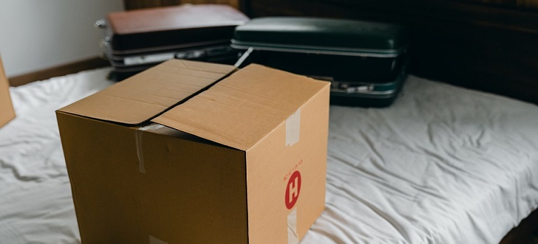 moving box and suitcases