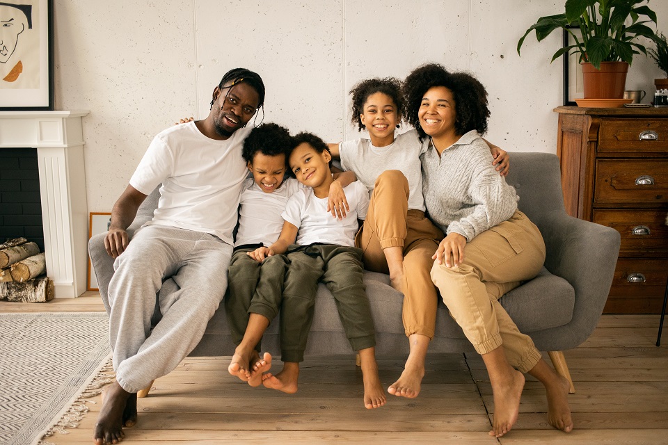 a family sitting on a sofa