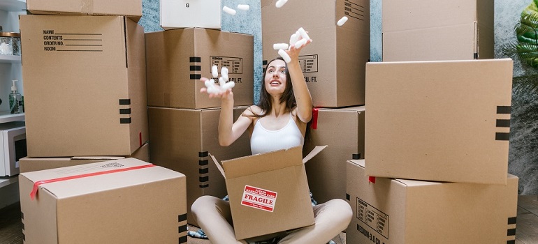 a girl packing her stuff 