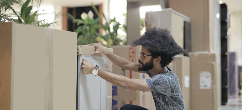 a mover ready to help people with tips for moving your office long distance