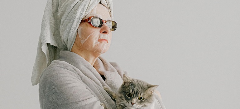 an older lady and her cat