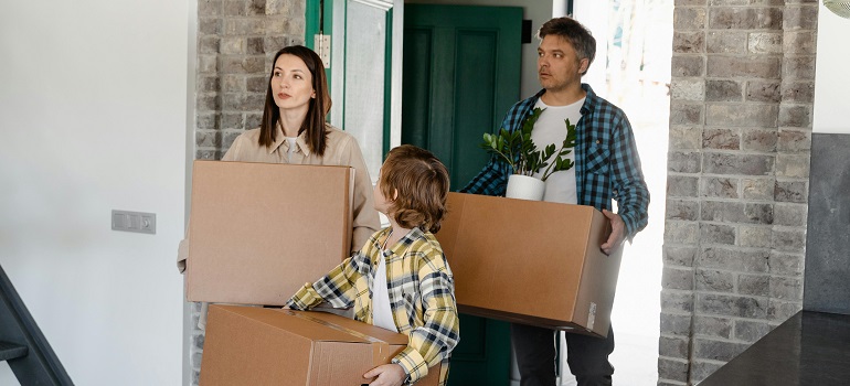people carrying moving boxes