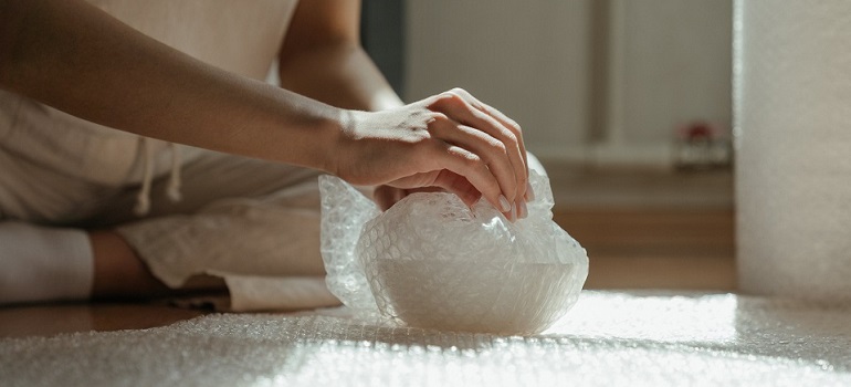 a girl making good use of professional packing services Canada company provides 