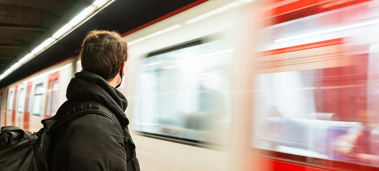 a man waiting for public transportation in Toronto