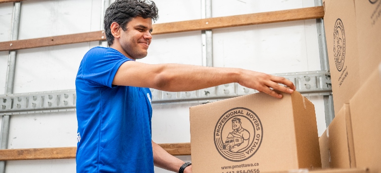 a mover carrying a box 