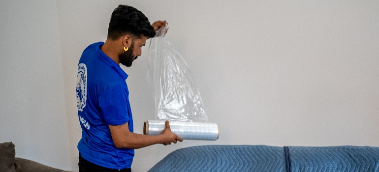 a mover holding a Strech wrap 