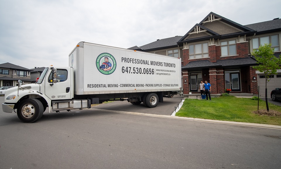 a moving truck in a driveway