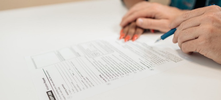 a man signing papers