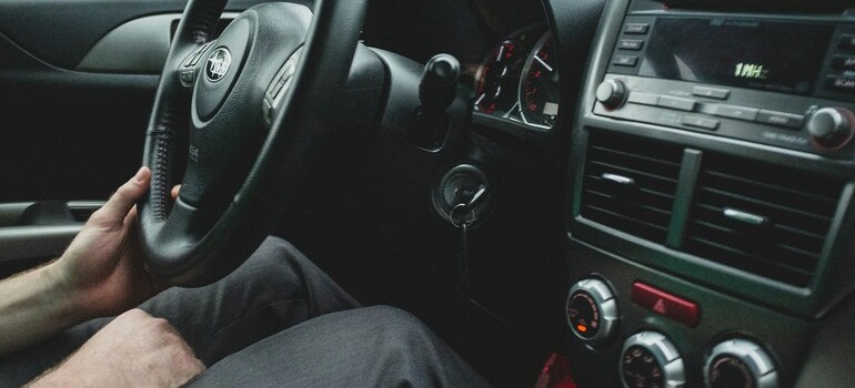 a man in a car on the route, following his timeline for moving to Brampton
