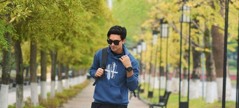 Man who knows why Vaughan is a hotspot for real estate investors walking alone in a tree-lined park