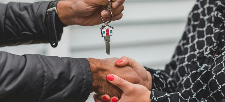 Hand holding a set of house keys