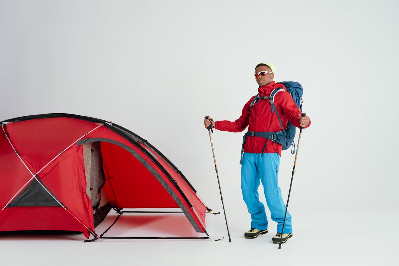a man in winter gear camping outside
