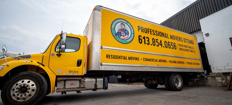 a yellow moving truck