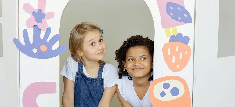 two kids in a dollhouse