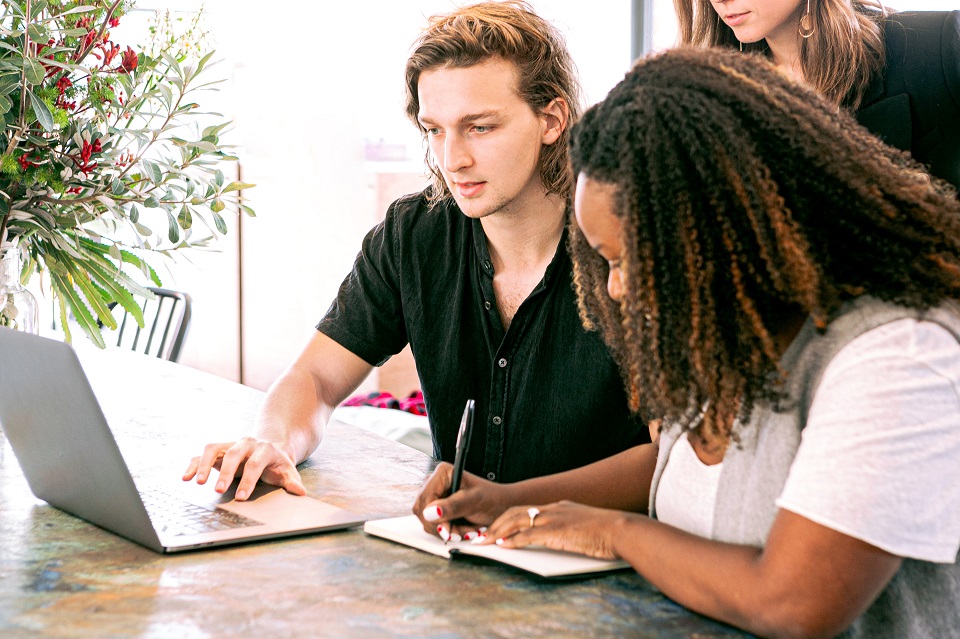 a group of young professionals working in an office