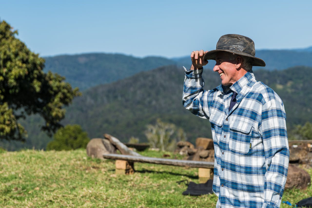 Farmer surveying land,