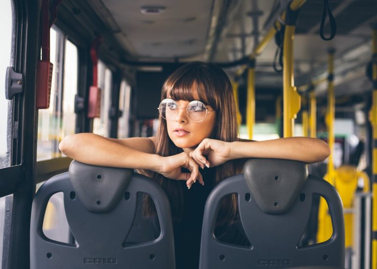 a young woman inside a bus