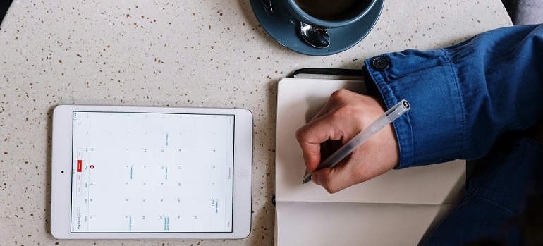 a man taking financial notes