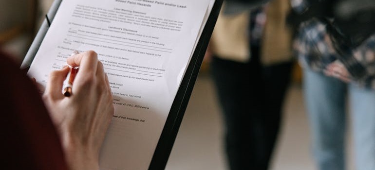Woman reviewing a document on a tablet.