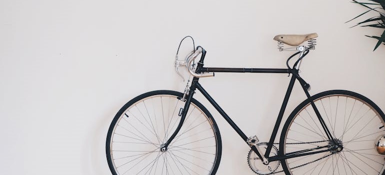 Vintage bicycle mounted on a white wall.