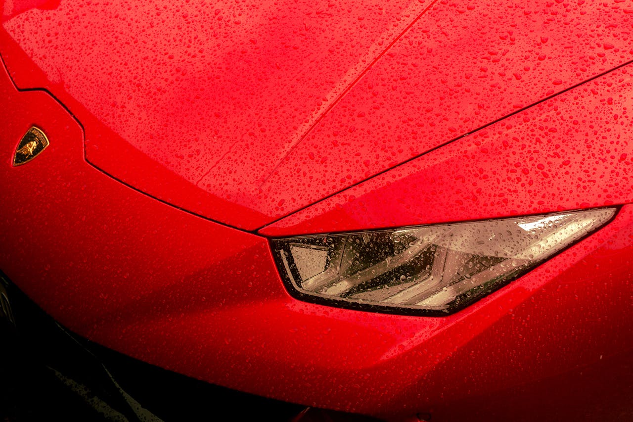 Lamborghini hood with water droplets.