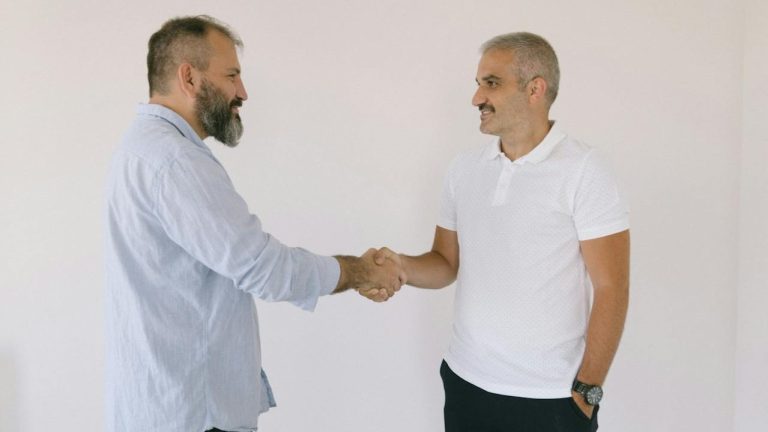 two men shaking hands