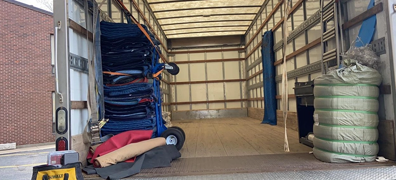 Specialized hydraulic gantries, forklifts, and air skates displaying the heavy-duty Equipment Used by Professional Industrial Movers for safe transport.