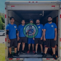 Moving truck parked on a residential street near The Kingsway, representing reliable Local Etobicoke Movers in action.