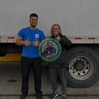 Branded moving truck parked at a residential driveway operated by reliable Local Innisfil Movers for a safe delivery.