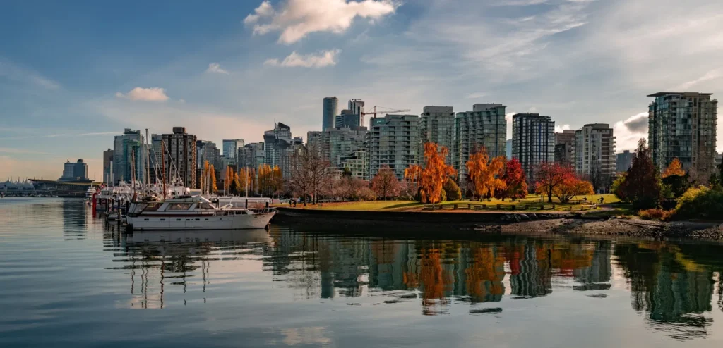 Professional Vancouver to Surrey movers loading a truck with secure packing materials for a safe long-distance relocation.