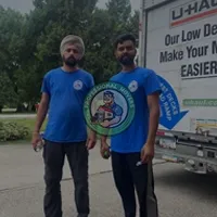 Professional team of Cambridge movers loading furniture securely into a clean moving truck for a residential relocation.